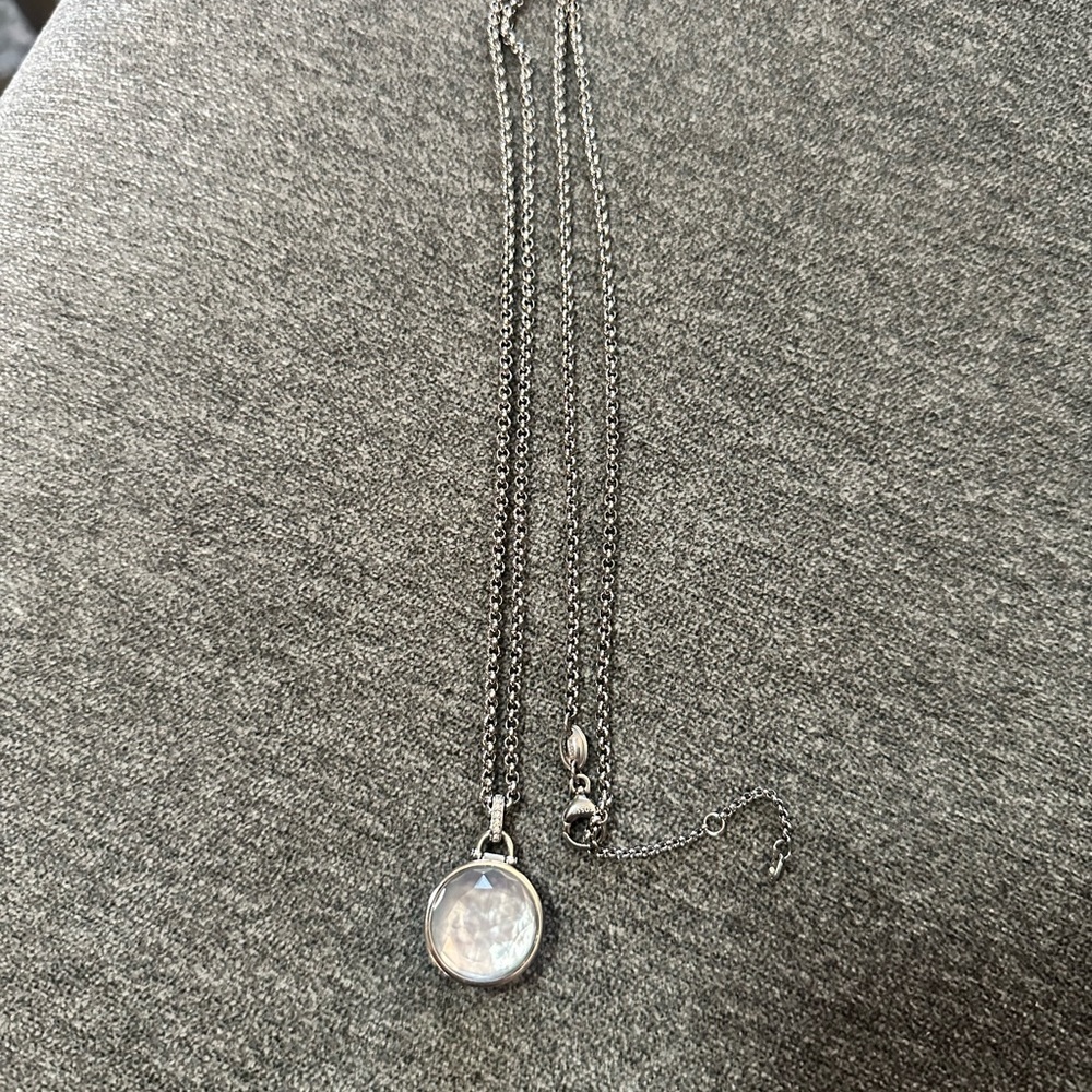 Silver FOSSIL necklace with rhinestone and crystal pendant.